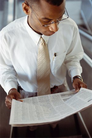 Businessman Reading Newspaper Stock Photo - Rights-Managed, Code: 700-00152778