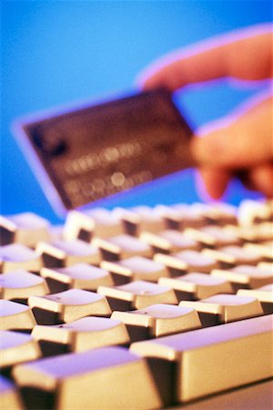 Hand with Credit Card and Computer Keyboard Stock Photo - Rights-Managed, Code: 700-00152998