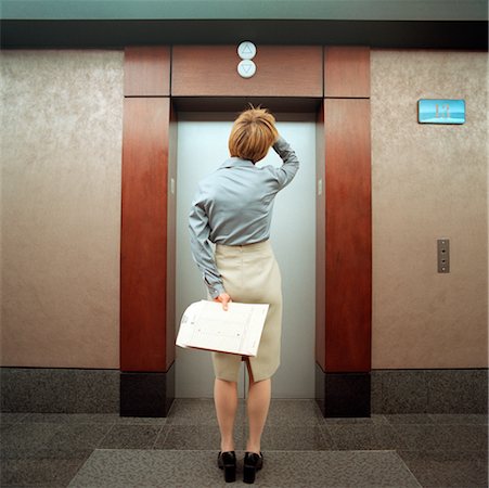 Businesswoman Waiting for Elevator Stock Photo - Rights-Managed, Code: 700-00153026