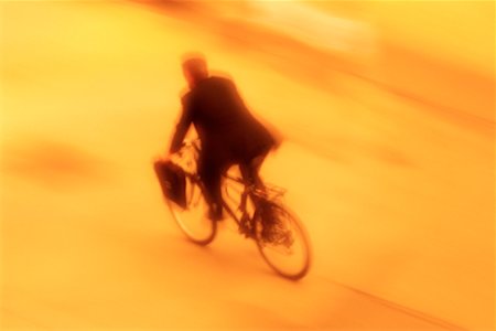 simsearch:700-00049670,k - Businessman Riding Bike Stock Photo - Rights-Managed, Code: 700-00153424