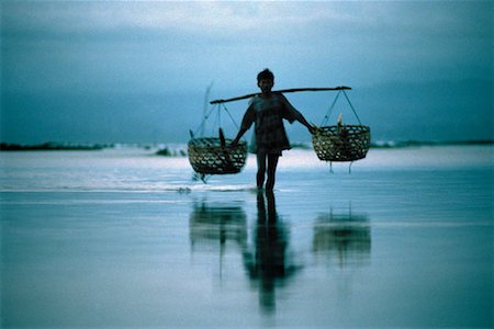 Man Carrying Baskets Nusa Lembongan, Bali, Indonesia Stock Photo - Rights-Managed, Code: 700-00153604