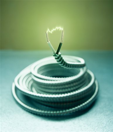 Coiled Extension Cord with Spark Stock Photo - Rights-Managed, Code: 700-00164379