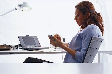 simsearch:700-00814372,k - Woman Working in Office Stock Photo - Rights-Managed, Code: 700-00165912