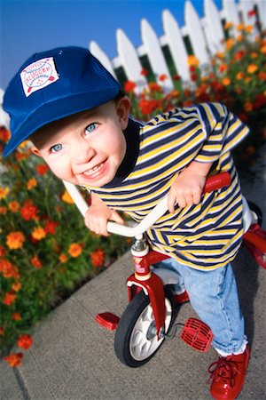 picket fence children - Boy on Tricycle Stock Photo - Rights-Managed, Code: 700-00166983