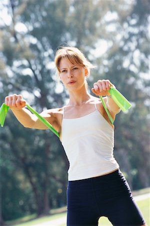 Woman Using Exercise Band Stock Photo - Rights-Managed, Code: 700-00167447