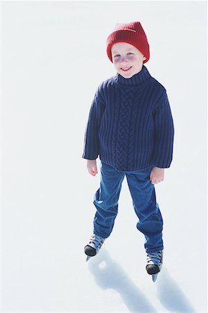 Boy Standing on Ice Wearing Skates Stock Photo - Rights-Managed, Code: 700-00167716