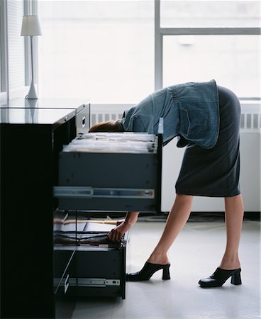 drawer pull - Businesswoman Looking In Filing Cabinet Stock Photo - Rights-Managed, Code: 700-00167864