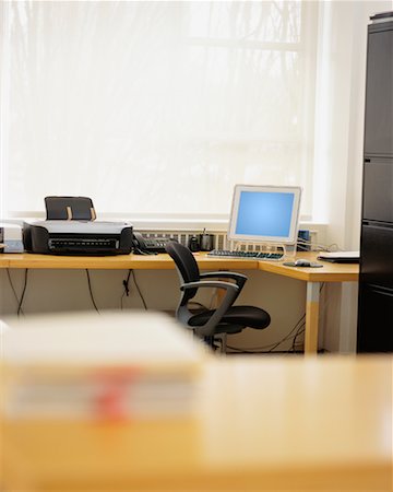 Desk with Computer and Empty Chair Stock Photo - Rights-Managed, Code: 700-00167865