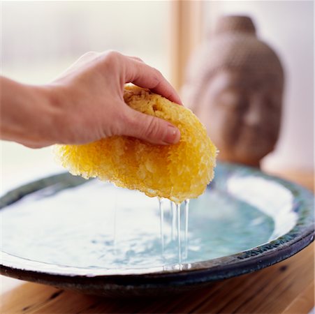 sponge bath woman - Woman Wetting a Sponge Stock Photo - Rights-Managed, Code: 700-00167989