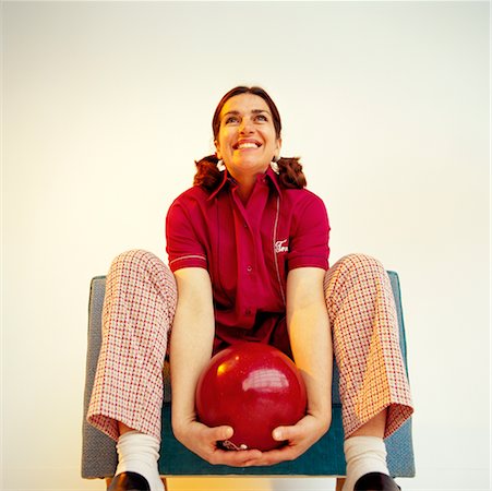 Woman Sitting in Chair Holding Bowling Ball Stock Photo - Rights-Managed, Code: 700-00168047