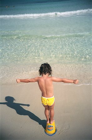 simsearch:700-01072527,k - Child Standing on Bucket on Beach Stock Photo - Rights-Managed, Code: 700-00168327