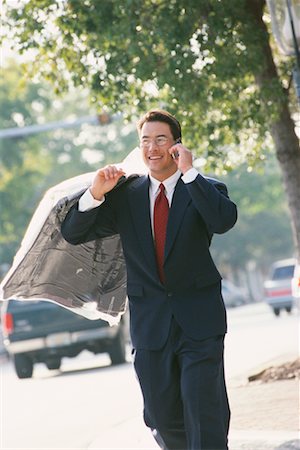 dry-cleaning - Businessman with Cell Phone and Dry Cleaning Stock Photo - Rights-Managed, Code: 700-00168590