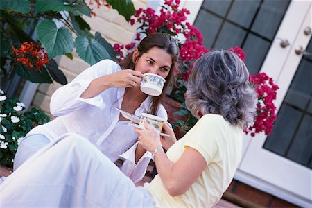 drinking coffee on patio - Friends Talking Stock Photo - Rights-Managed, Code: 700-00168717