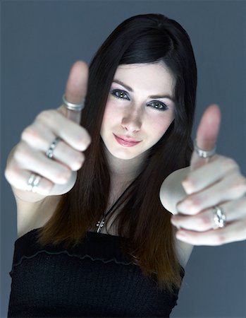 dan lim - Young Woman Giving Thumbs Up Fotografie stock - Rights-Managed, Codice: 700-00169345