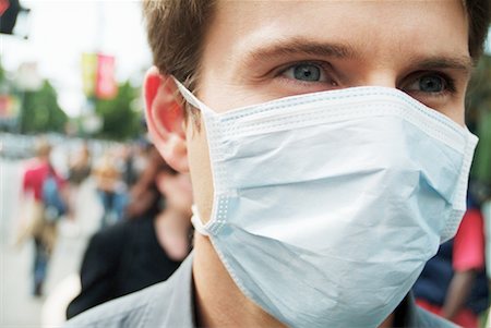 simsearch:700-00806816,k - Man Wearing Face Mask Outdoors Foto de stock - Con derechos protegidos, Código: 700-00169947