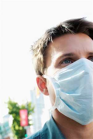 simsearch:700-00806818,k - Man Wearing Face Mask Outdoors Stock Photo - Rights-Managed, Code: 700-00169940