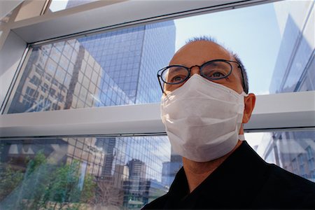 simsearch:700-00806816,k - Man Wearing Face Mask Foto de stock - Con derechos protegidos, Código: 700-00169972