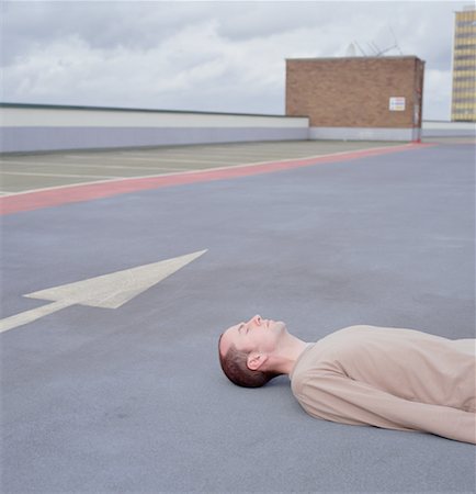 Dead Man in Parking Lot Stock Photo - Rights-Managed, Code: 700-00160713