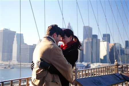simsearch:700-00527046,k - Young Couple Hugging on Bridge Fotografie stock - Rights-Managed, Codice: 700-00160926