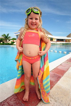 Girl Standing by Swimming Pool Foto de stock - Con derechos protegidos, Código: 700-00161684