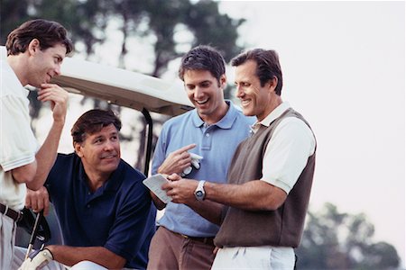 Men Looking at Golf Score Card Foto de stock - Direito Controlado, Número: 700-00163044