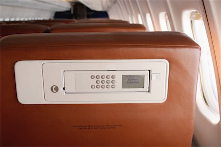 Phone in Seat of Airplane Foto de stock - Con derechos protegidos, Código: 700-00163086