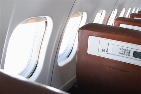 Phone in Seat of Airplane Foto de stock - Con derechos protegidos, Código: 700-00163087