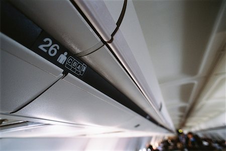passenger inside airplane - Overhead Compartment Stock Photo - Rights-Managed, Code: 700-00163392