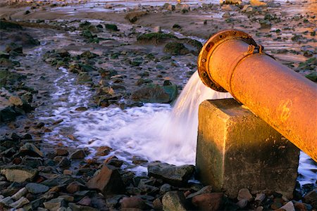 Water Sewage Pouring out of Pipe Fotografie stock - Rights-Managed, Codice: 700-00163524