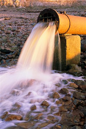 Sewage Water Pouring out of Pipe Fotografie stock - Rights-Managed, Codice: 700-00163522