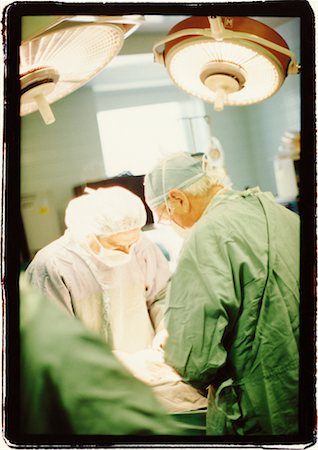 simsearch:640-01361207,k - Doctors Performing Surgery Stock Photo - Rights-Managed, Code: 700-00177590