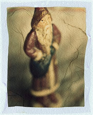 simsearch:700-02972955,k - Photograph of Santa Figurine on Textured Paper Stock Photo - Rights-Managed, Code: 700-00177660