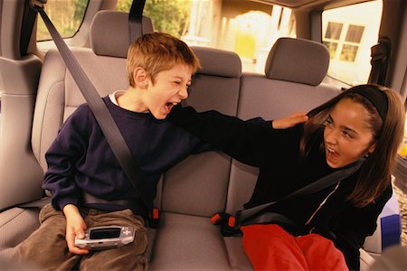 Children Fighting in Back Seat Of Van Stock Photo - Rights-Managed, Code: 700-00177743