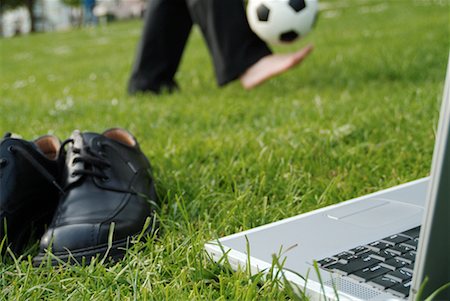 Shoes, Laptop Computer and Businessman Playing Soccer Stock Photo - Rights-Managed, Code: 700-00178011