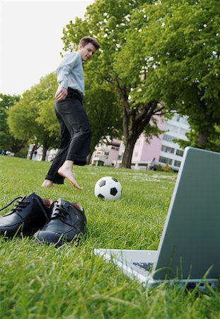 Businessman in Park, Playing Soccer Stock Photo - Rights-Managed, Code: 700-00178013