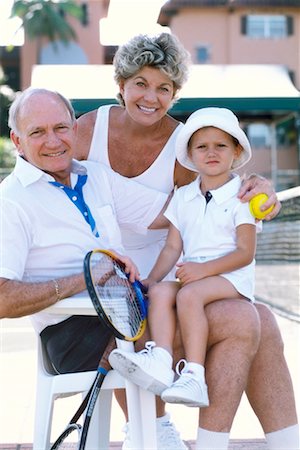 seniors photography girls playing sports - Grandparents with Granddaughter At Tennis Court Stock Photo - Rights-Managed, Code: 700-00178437