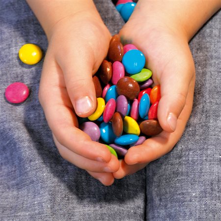 Child's Hands Holding Candy Stock Photo - Rights-Managed, Code: 700-00178735