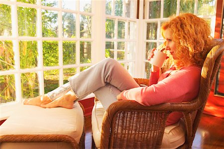 porch coffee - Woman Relaxing in Sun Room Stock Photo - Rights-Managed, Code: 700-00178755