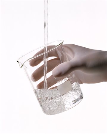 rubber hand gloves - Hand Holding Beaker with Water Stock Photo - Rights-Managed, Code: 700-00178750