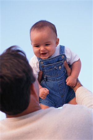 father and son overalls - Father Lifting Baby Foto de stock - Con derechos protegidos, Código: 700-00178957