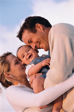 simsearch:700-00178962,k - Mother and Father Holding Son Fotografie stock - Rights-Managed, Codice: 700-00178959