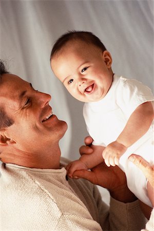 simsearch:700-00075913,k - Père Holding Baby Photographie de stock - Rights-Managed, Code: 700-00178960