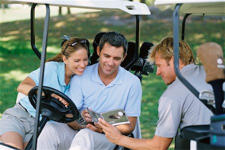 People Looking at Golf Score Cards Foto de stock - Direito Controlado, Número: 700-00179001