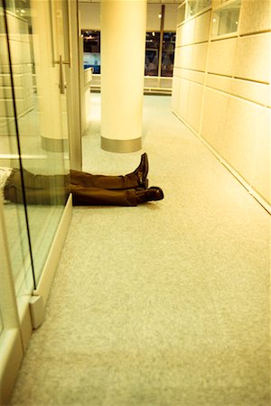 Man Lying on Floor Stock Photo - Rights-Managed, Code: 700-00179254