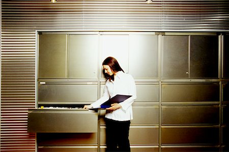 document drawer - Woman in Front of Cabinets Stock Photo - Rights-Managed, Code: 700-00184955