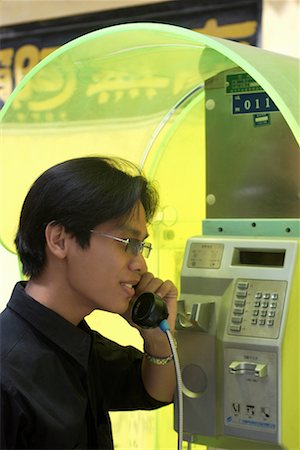 payphones in china - Teenager Talking on Telephone Stock Photo - Rights-Managed, Code: 700-00184999