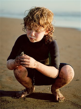 Boy in Wetsuit on Beach Stock Photo - Rights-Managed, Code: 700-00185999