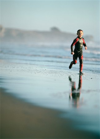 stinson beach - Boy in Wetsuit on Beach Fotografie stock - Rights-Managed, Codice: 700-00186007