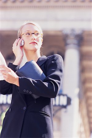 Businesswoman with Cell Phone and Newspaper Stock Photo - Rights-Managed, Code: 700-00189526