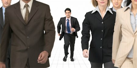 Businessman Running Towards Group of Business People Stock Photo - Rights-Managed, Code: 700-00189781